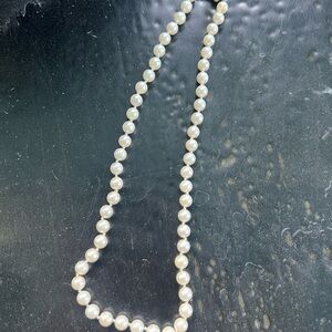 Zales Genuine pearl necklace with 14KT gold bow clasp.